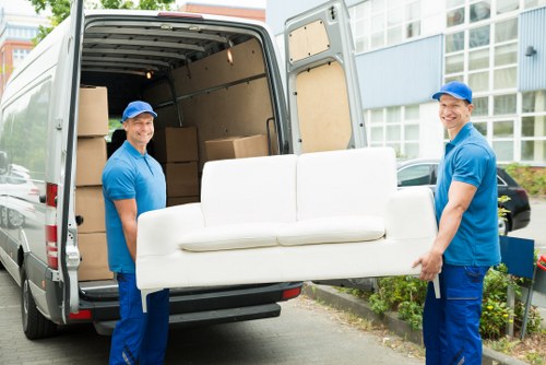 Packed furniture and boxes ready for a Surrey moving truck