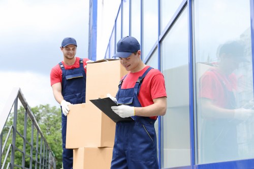 Team separating cardboard and metals for recycling during a move