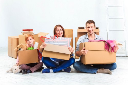 Packed moving boxes and furniture ready for house removals in Surrey