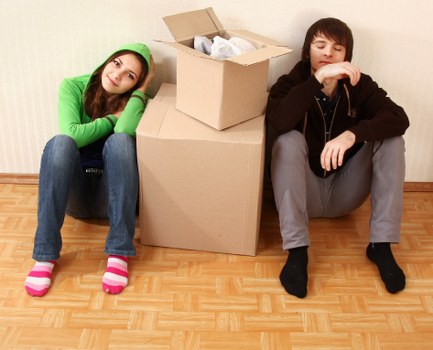 Local moving team handling boxes and household items in Surrey
