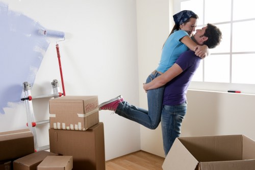 Removal team loading furniture for a Surrey house move