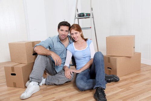 Business removals team transporting office furniture