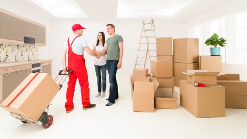 Unpacking boxes in a Surrey property after relocation