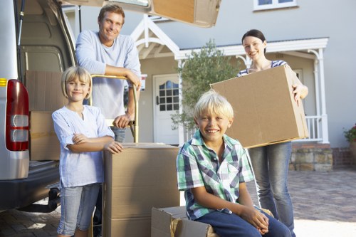 Boxes and furniture arranged to show cubic-yard pricing for a Surrey move