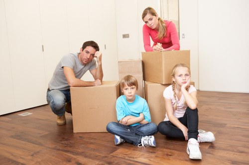 Professional removals team handling furniture in a Surrey house move