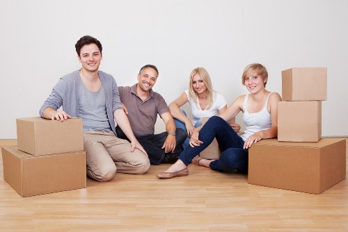 Local moving team loading furniture into a van in Surrey